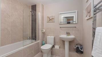 Bathtub, hair dryer, towels