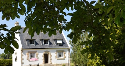 House with spacious garden and open views over the countryside.