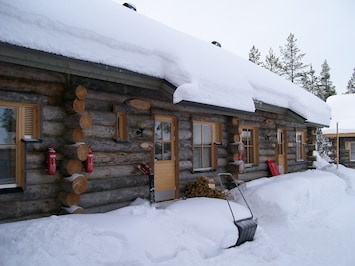 The cabin under its cozy blanket of snow