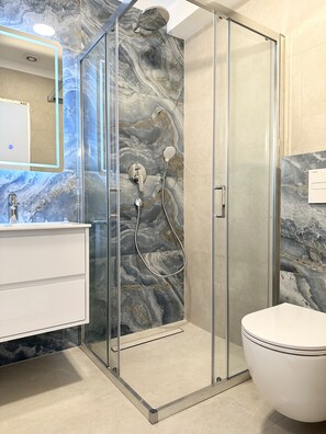 Shower, hair dryer, towels, soap