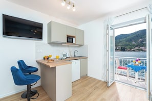 Enjoy meals in the kitchen with a central island and microwave, then dine by the window overlooking a scenic view.