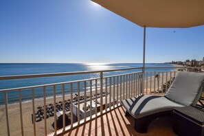 A balcony with a view of the beach and ocean. - Ref: 200  Beachfront apartment with pool and stunning sea views (Fuengirola)