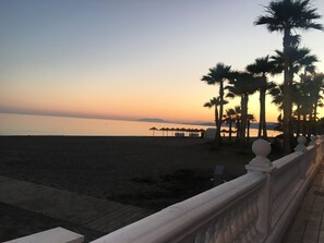 On the beach, sun-loungers