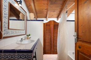 Bathtub, hair dryer, towels