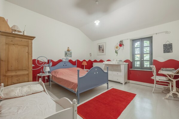 A bedroom with a bed, a desk, a chair, a wardrobe, and a window. - House with character (Lézat-Sur-Lèze)
