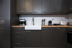 Microwave, coffee/tea maker, cookware/dishes/utensils