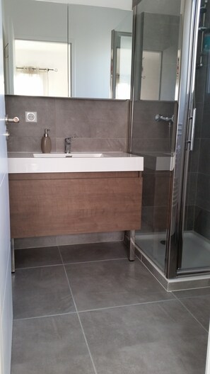 Bathtub, hair dryer, towels, soap