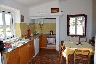 Gardian's house surrounded by vineyards and oak and olive  trees