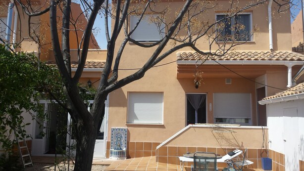 A residential building with a tiled patio, a small pool, and a tree in the foreground. - La Cuesta Blanca House or chalet (Castilla de la Mancha)