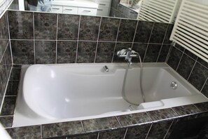 Bathtub, hair dryer, towels