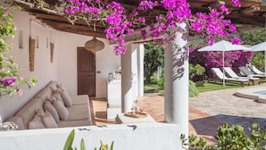 A covered outdoor seating area with a pergola, a pool, and lounge chairs. - Beautiful Country Villa With Private Pool & Huge Garden (Sóller)