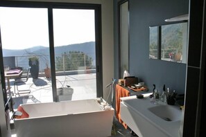Bathtub, hair dryer, towels, soap