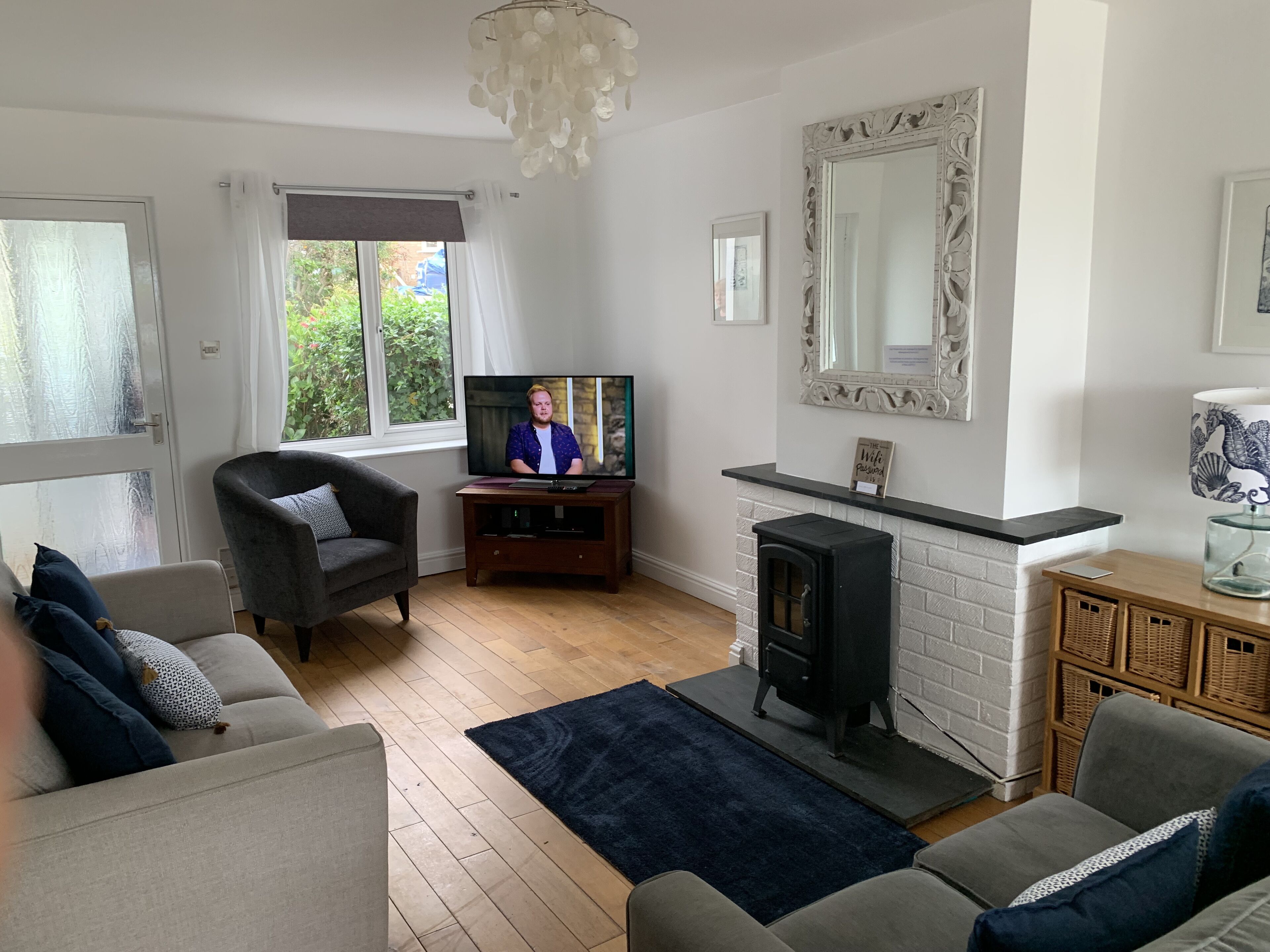 Open plan lounge and ding with patio doors to decking