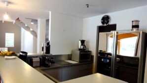 A modern kitchen with a built-in oven, microwave, and coffee maker. - House / Villa - SAINT FRANçOIS (Saint François)