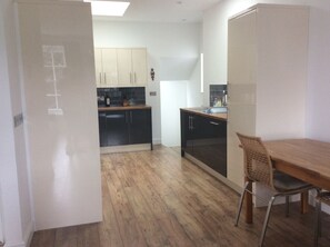 Enjoy meals at the dining table in this cozy kitchen area.