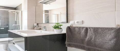 Hair dryer, towels, soap, shampoo