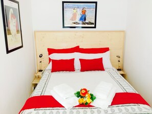 1 habitación, tabla de planchar con plancha, wifi gratis y ropa de cama 