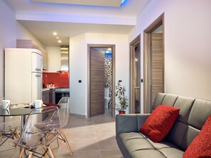 สแตนดาร์ดอพาร์ทเมนท์ | บริเวณนั่งเล่น | ทีวีจอแบน