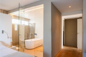 Bathtub, hair dryer, towels, soap