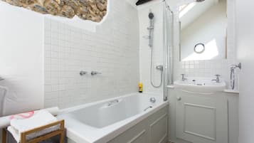 Combined shower/bathtub, hair dryer, towels, soap