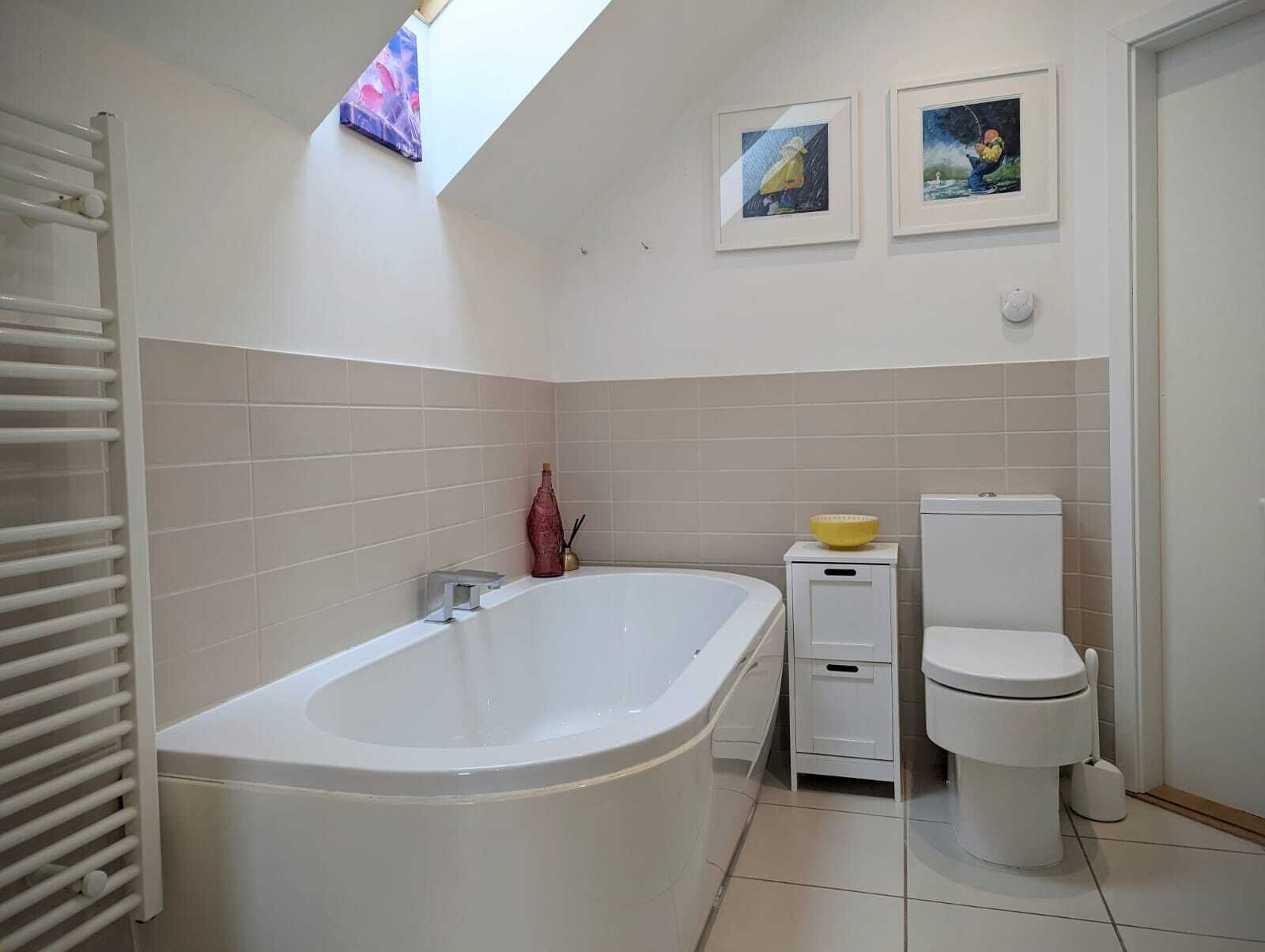 Primary bathroom, with bathtub and separate shower 
