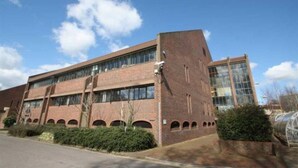 A modern building with a brick facade, large windows, and a flat roof. - Toothbrush Apartments - Central Ipswich East - Rope Walk (Ipswich)