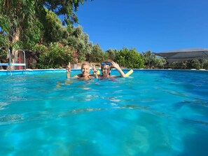 Pool - house-apartments ground floor panoramic view on sea  fortress above ground pool (Methoni - Messenia - Peloponnese - Grecia)