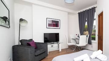 Traditional Apartment, 1 Bedroom | Living area | 42-inch flat-screen TV with digital channels, TV