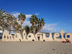 On the beach, sun-loungers