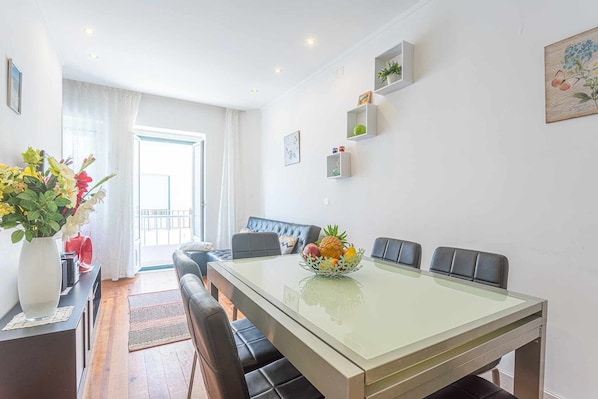 Enjoy meals in this stylish dining area with a glass-top table and comfortable black leather chairs.
