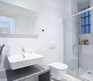 Shower, hair dryer, towels, soap