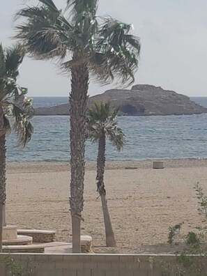 On the beach, sun-loungers
