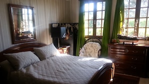 A bedroom with a large bed, a wooden dresser, a chair, and a mirror. - 2 ROOMS FOR RENT TWO STEPS FROM THE SEA (Ault)