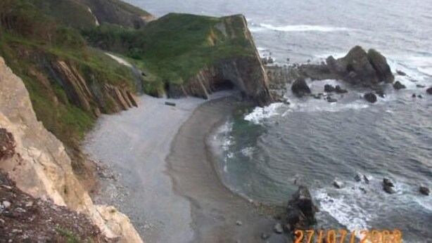 A coastal landscape with cliffs, a beach, and the ocean. - Apartamentos Jesús for 4 people (Valdés)