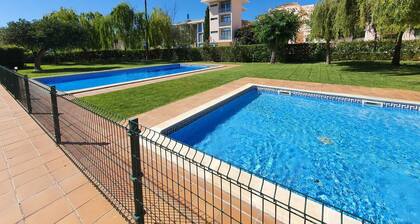 Apartment in lovely setting with two pools
