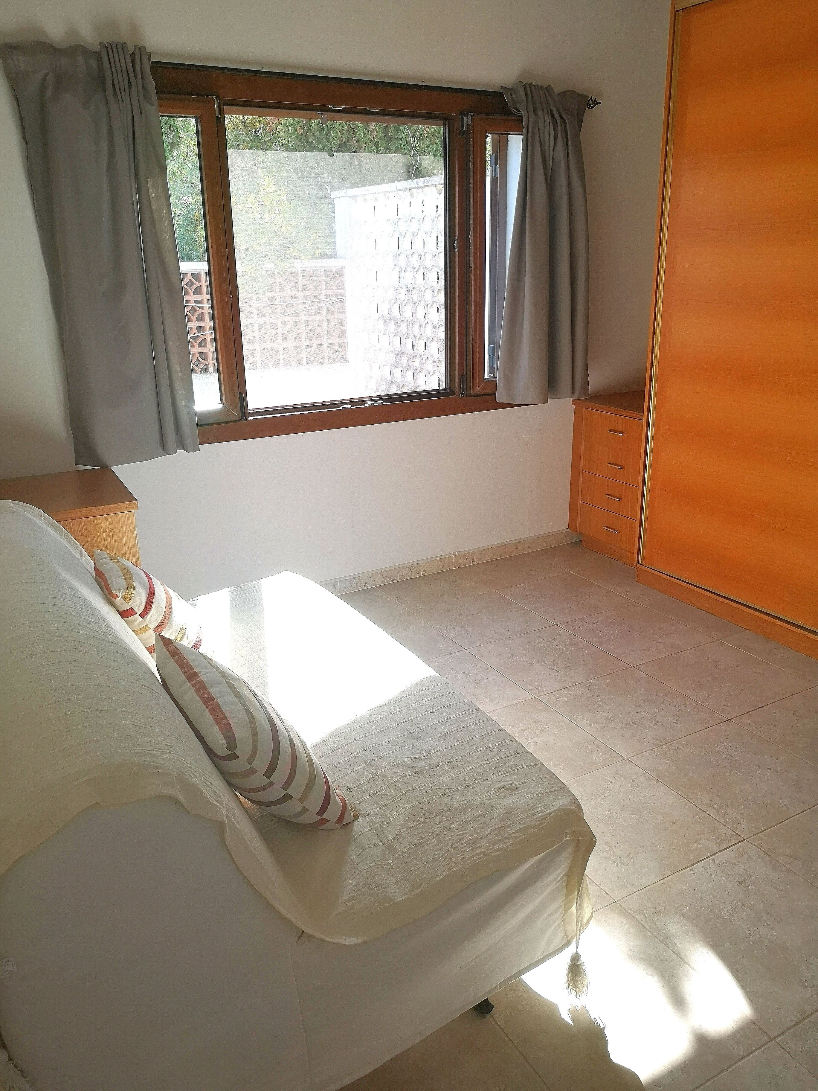 Dressing room/sofa bed leading from master bedroom