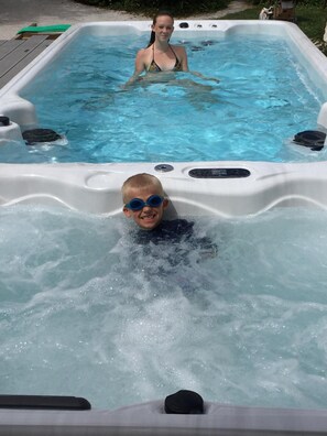 Relax in this spacious hot tub with jets for a soothing experience.