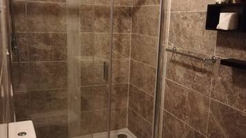 Shower, hair dryer, towels, soap