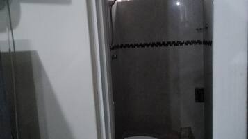 Shower, hair dryer, towels, toilet paper