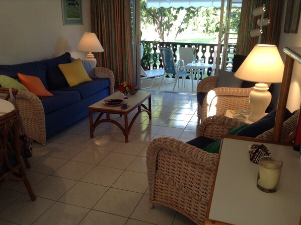 Living area with ceiling and standing fan