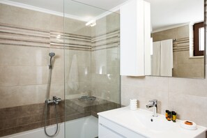 Combined shower/tub, hair dryer, towels, soap