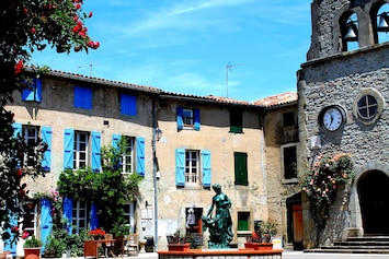 Chez Maison Bleue on the village square by the beautiful old church