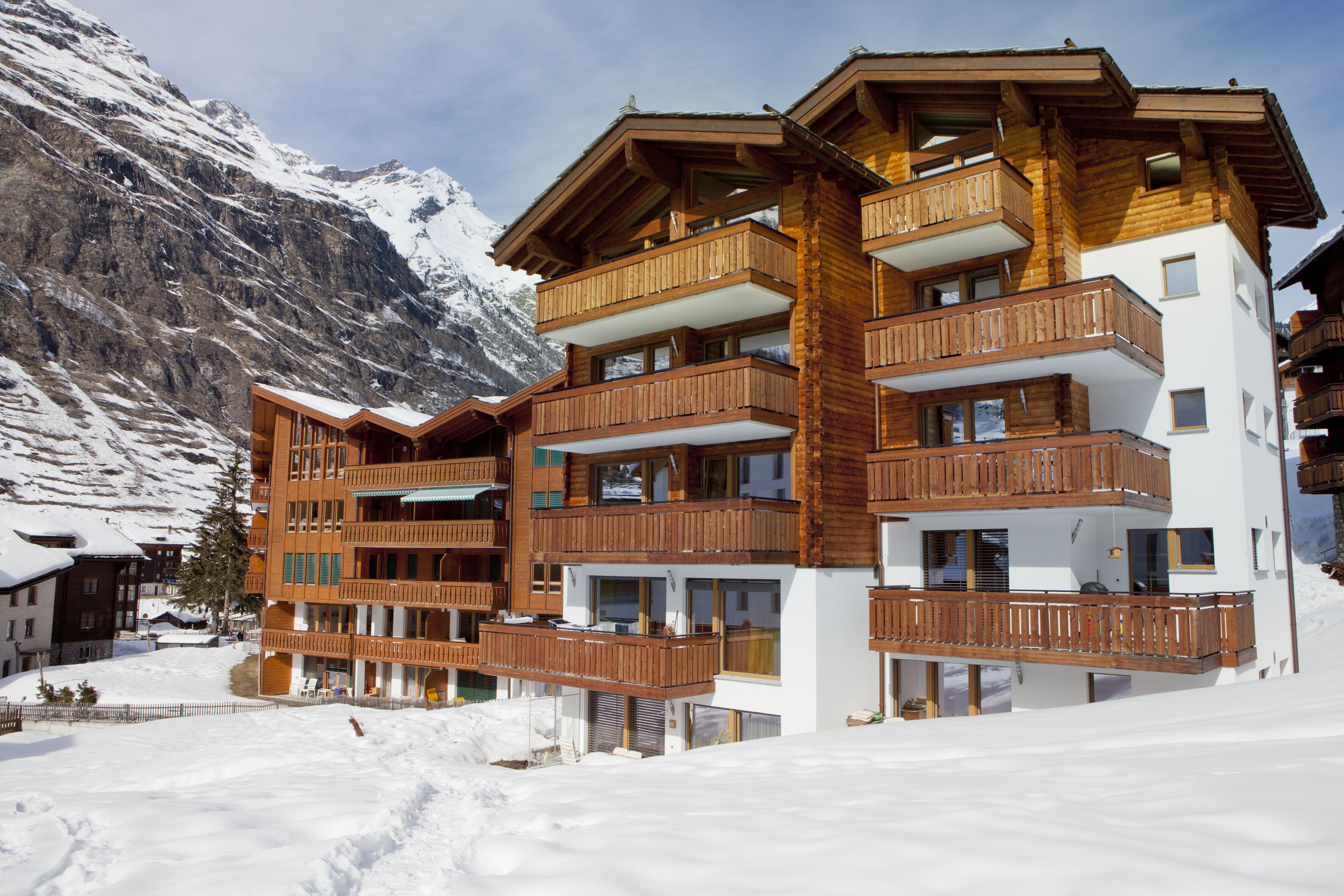 Our building (Haus Maoli) viewed from path across our field in the winter 