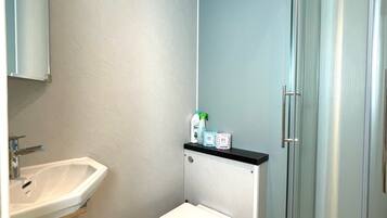 Combined shower/tub, hair dryer, towels, soap