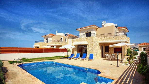 A two-story house with a swimming pool, outdoor seating, and a stone facade. - Villa Chrisanthi 300m from Coast Free (Coral Bay)