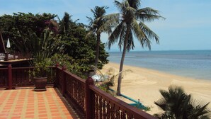 A beach view from a balcony with a tiled floor and a railing. - 3 bed beach front villa (Koh Samui)