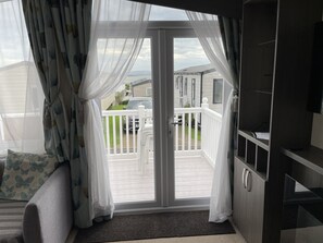 TV, fireplace, DVD player, books - Rambling Rose caravan with sea view on Rockley Park (Poole)
