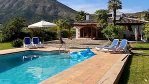 A pool area with lounge chairs and a mountain in the background. - Five stars reviews - Peaceful - Fantastic pool - Privacy & Long views (Jávea)