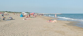 Pink artist's house on the edge of the lagoon, overlooking Torcello and the Alps.