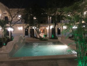 Outdoor pool, open 8:00 AM to 7:00 PM, pool loungers
